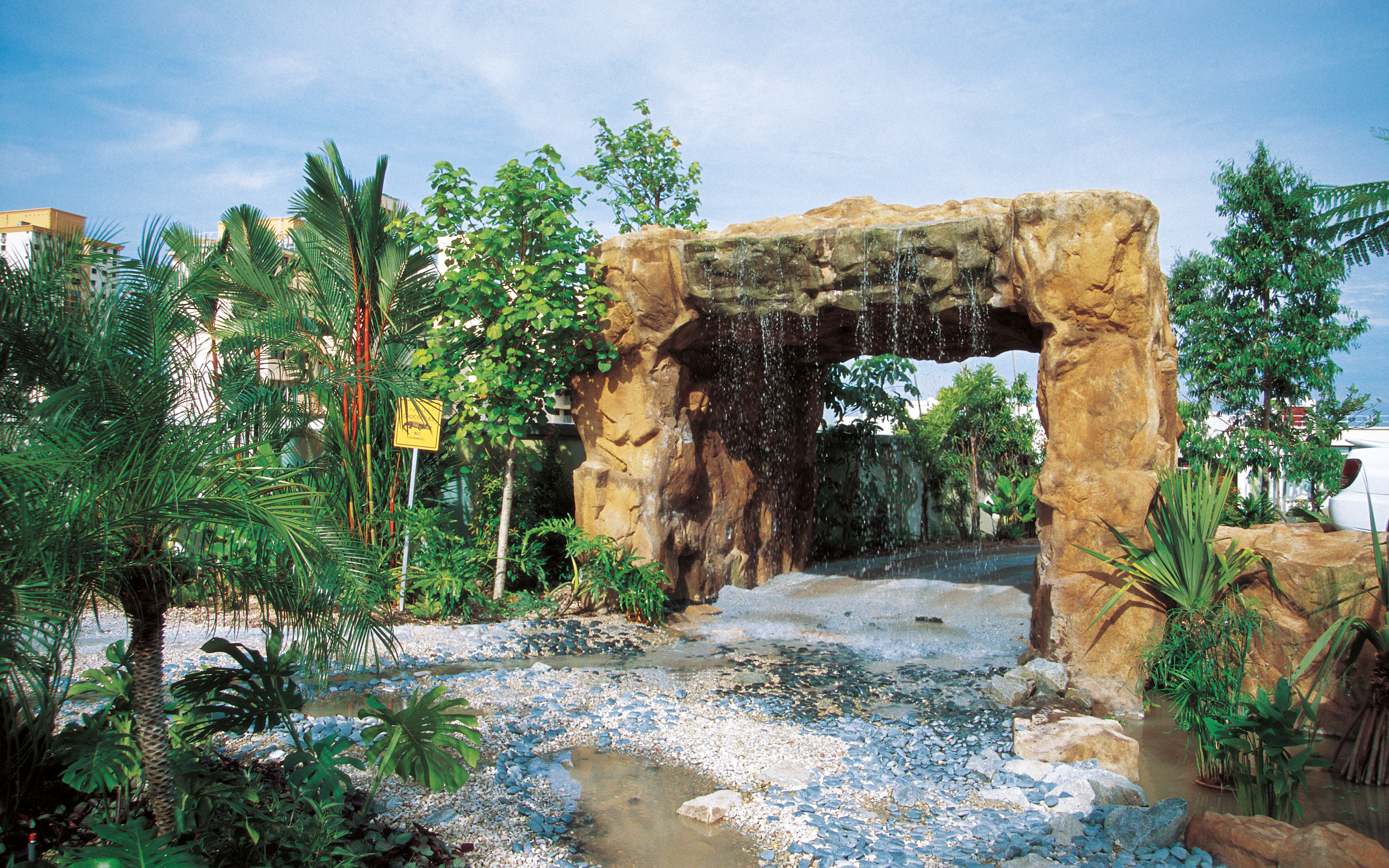 Even a waterfall was integrated within the circuit. Archway with waterfall and tropical vegetation